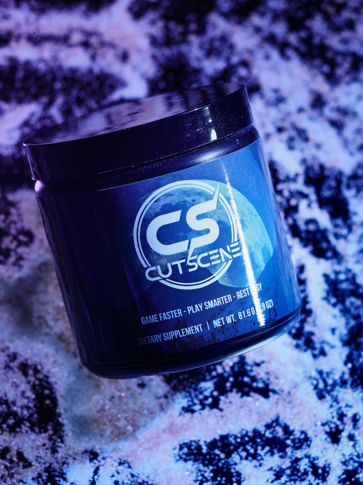 CutScene Product (34 scoop tub) displayed on top of scattered powder.