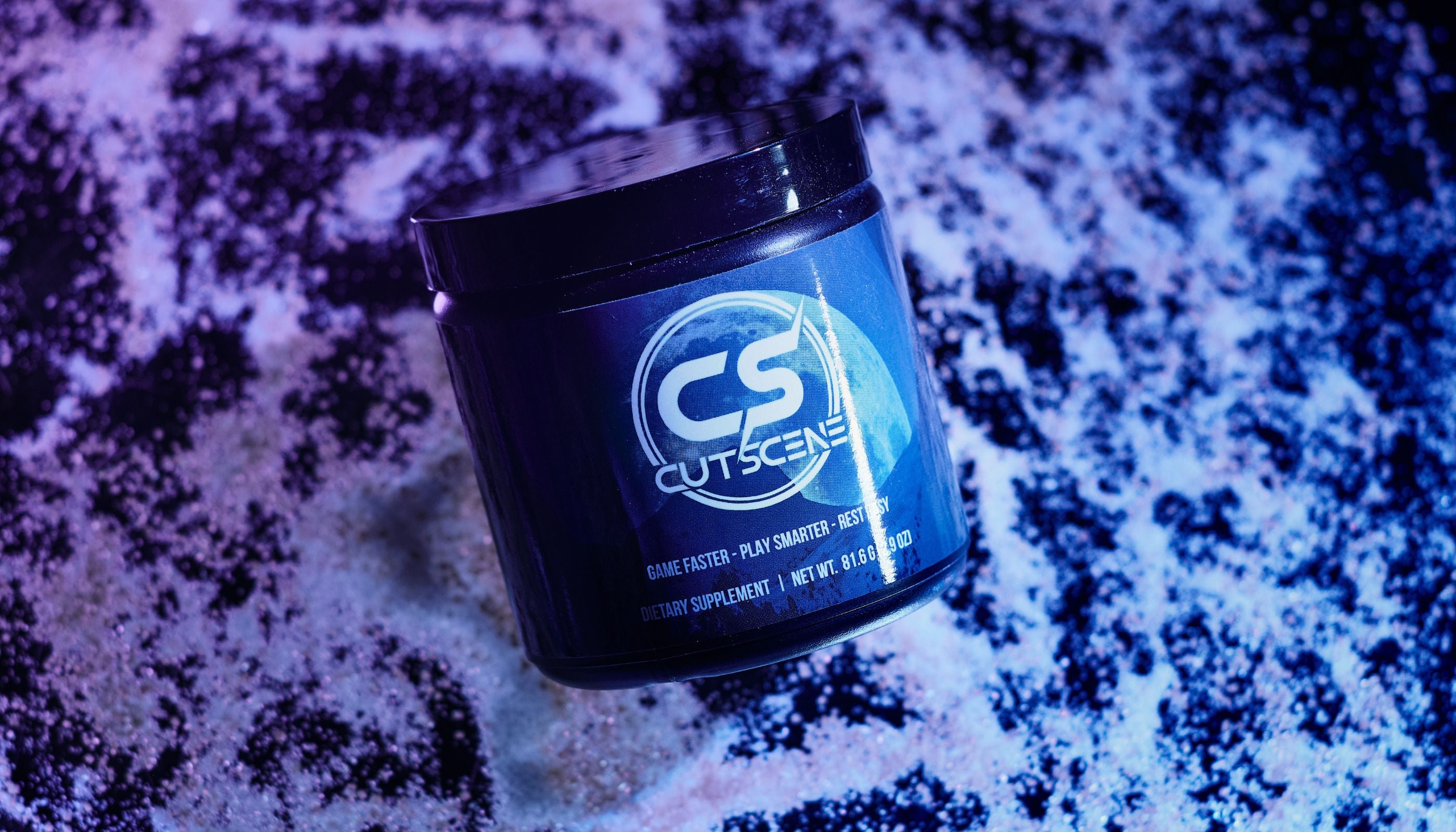 CutScene Product (34 scoop tub) displayed on top of scattered powder. 